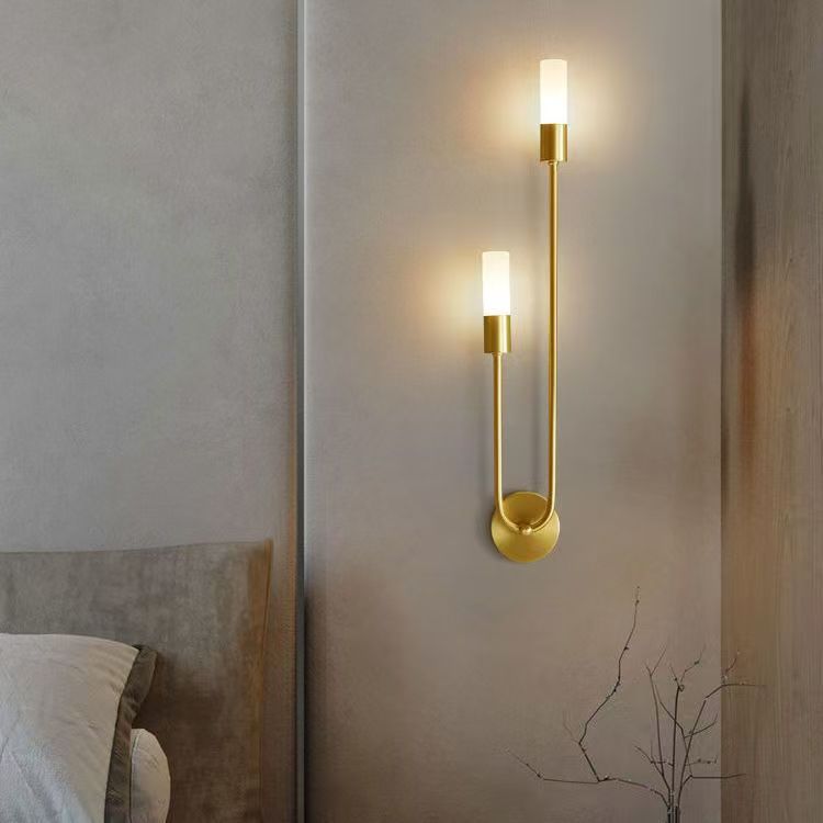 Long bedside wall lamp in the bedroom