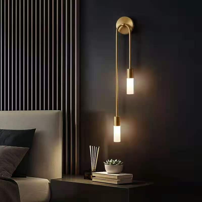 Long bedside wall lamp in the bedroom