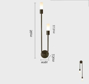 Long bedside wall lamp in the bedroom